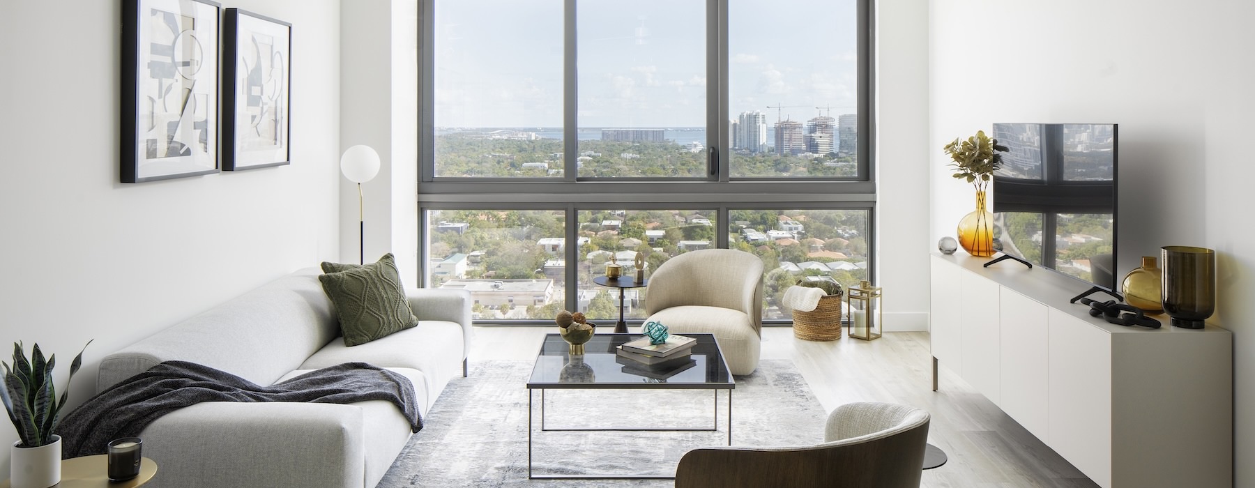 living room with seating and large windows