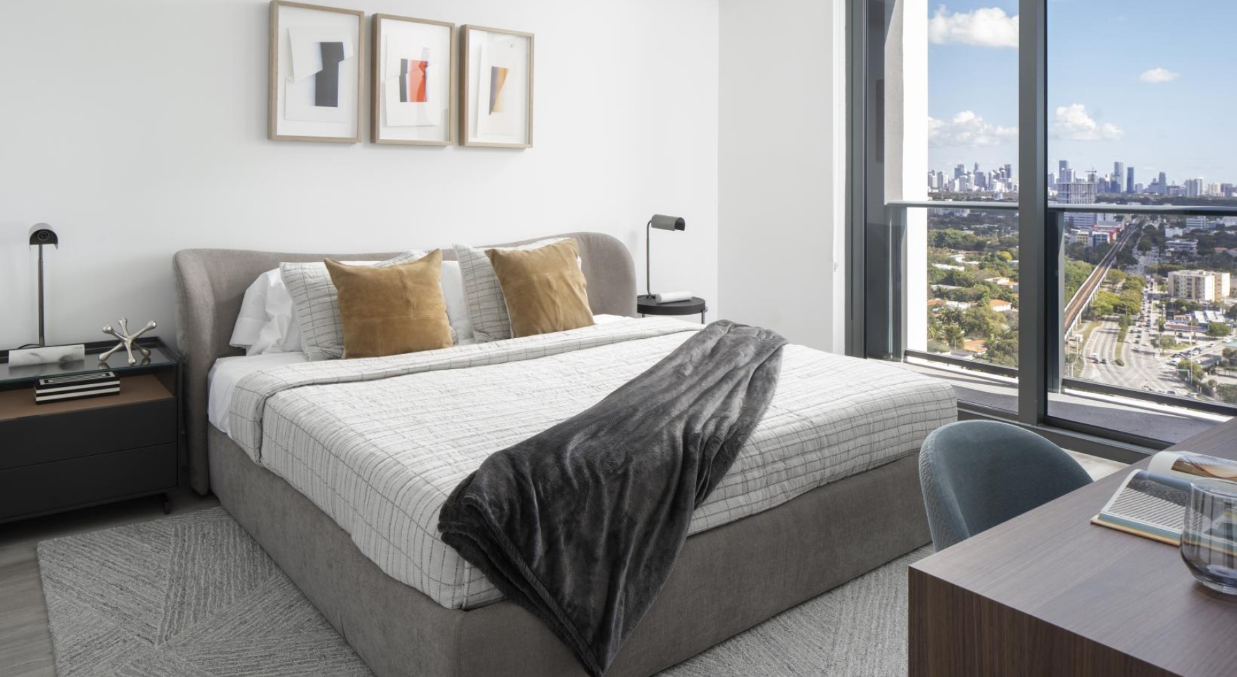 bedroom with bed and art above it